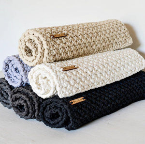 Bathmats handmade from recycled spaghetti yarn.