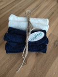 Odd Pod Reusable Baby Wipes in cotton towelling, in both blue and white options rolled up.