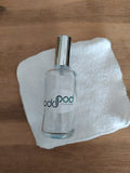 Glass Spray Mist bottle with cap, in 100 ml size, featured with a white reusable baby wipe.