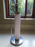 Odd Pod Kitchen Unpaper Towel in white flannel, shown on a kitchen paper towel holder. These reusable wipes can be used in the same way as standard kitchen paper towels.