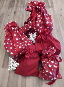 Odd Pod 100% cotton gift bags in lovely red and red with white stars, sealed with a red ribbon. Various sizes available in the sets offered.