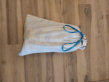 The Odd Pod baby bib comes with this handy cotton bag.